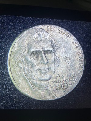 2007 Jefferson nickel off-center strike error showing design shifted with crescent of blank planchet